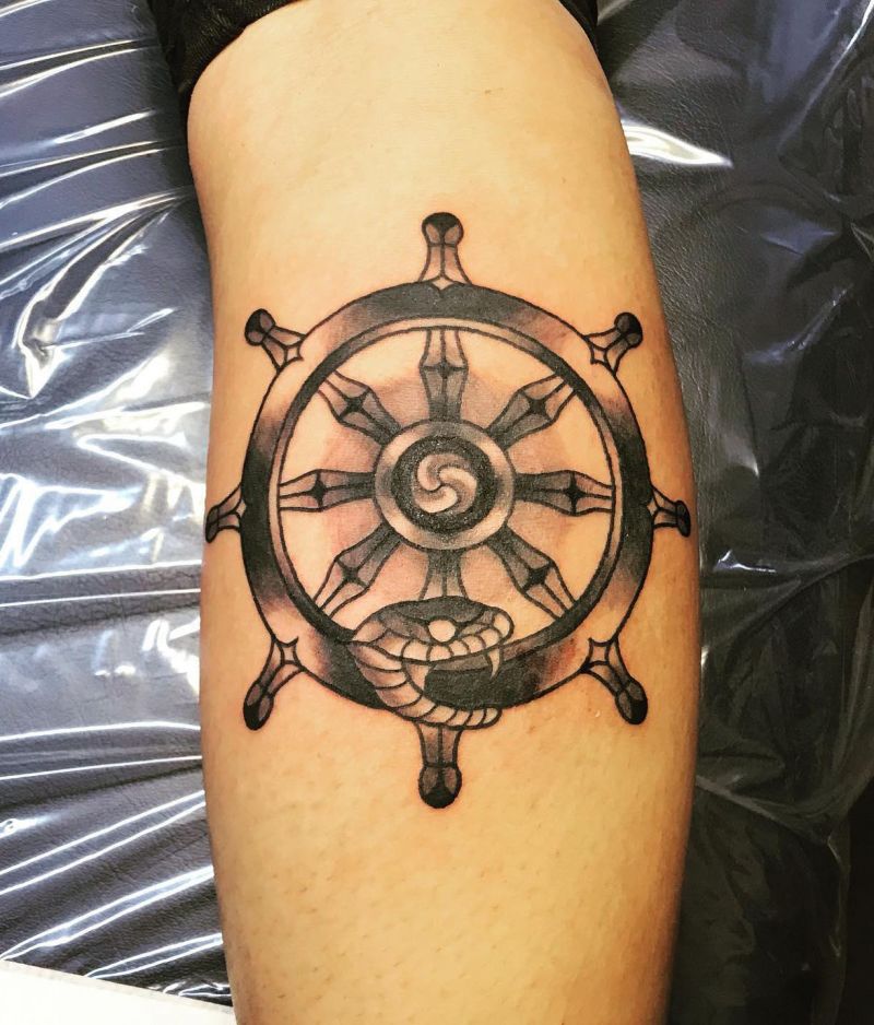 30 Awesome Dharma Wheel Tattoos to Inspire You